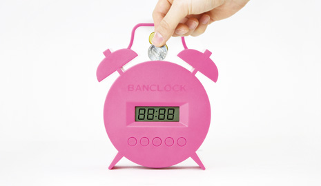 The bell rings.Alarm sound stops when coin is inserted.